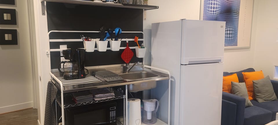 The apartment has been updated with a bigger refrigerator.
