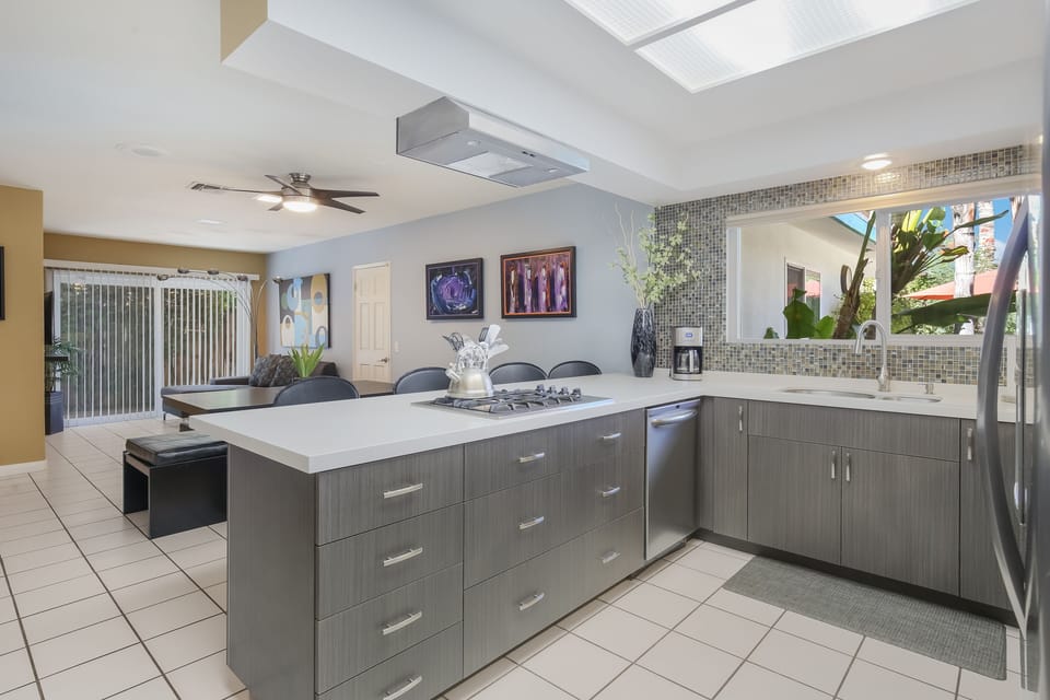 View of eating area and tv den from kitchen