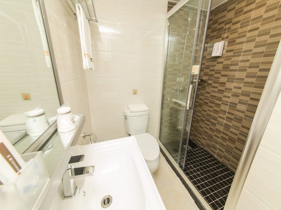 Shower, free toiletries, hair dryer, slippers