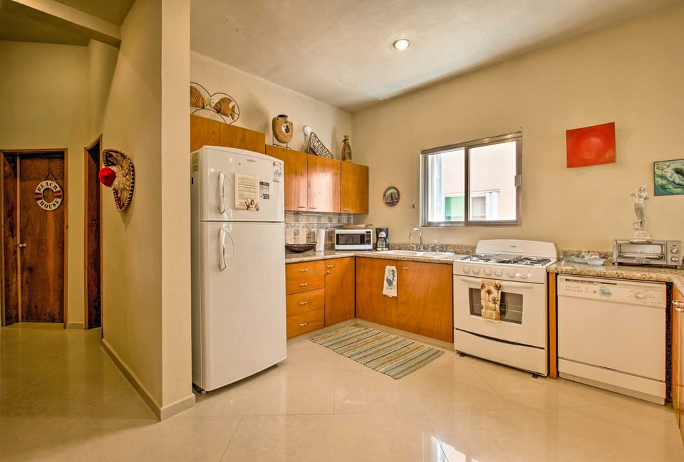 Walk down the hall from the 1st bedroom into the fully equipped kitchen.