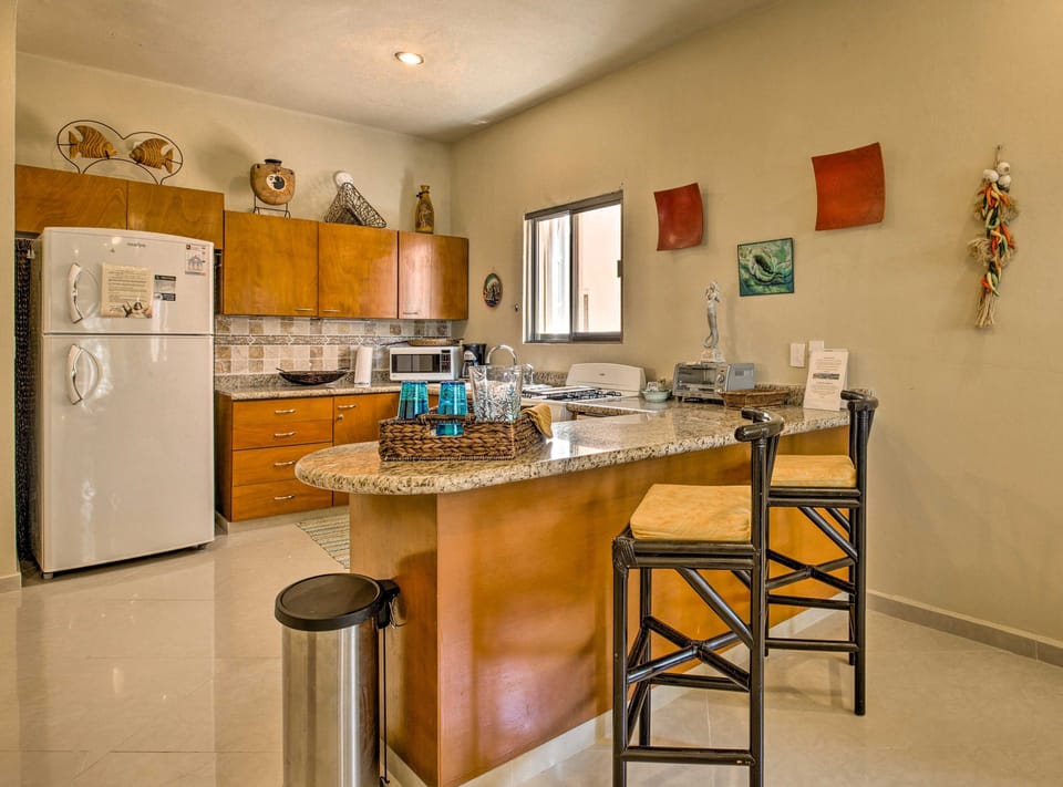 Granite counters w/tile backsplash kitchen, where most everything is provided.