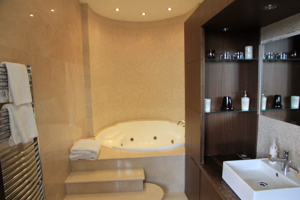 Master bath with whirlpool tub.