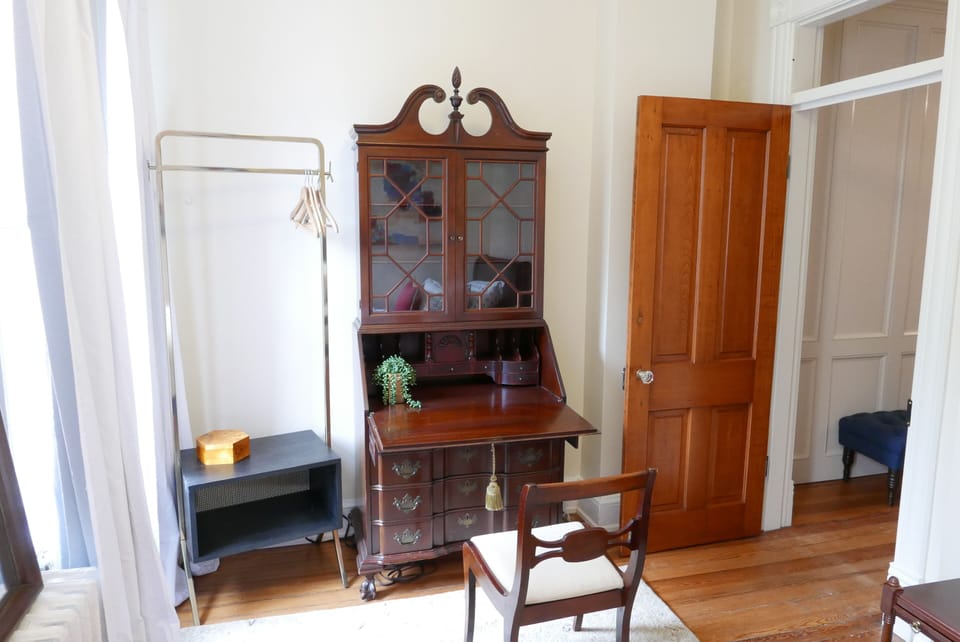 Twin bedroom with beautiful secretary desk storage