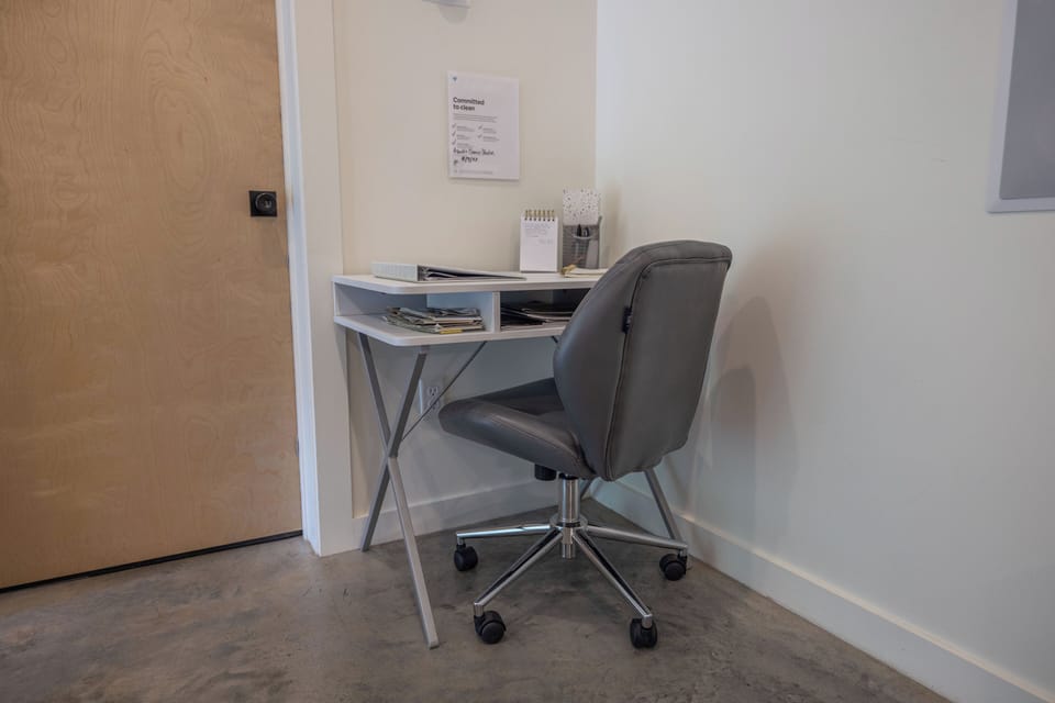 Office Desk and a comfy chair for remote working. 

