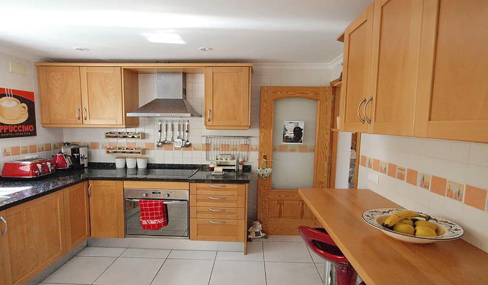 The kitchen with the doorway out to the main entrance hall