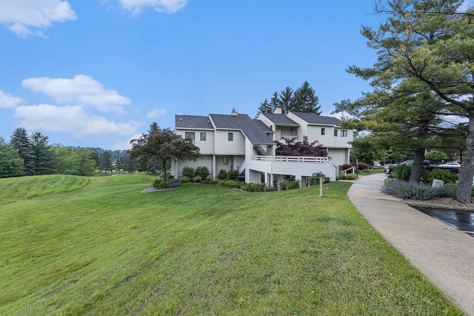 Breathe in the fresh morning air from your double-deck balcony overlooking the rolling fairways of The Wolverine course.