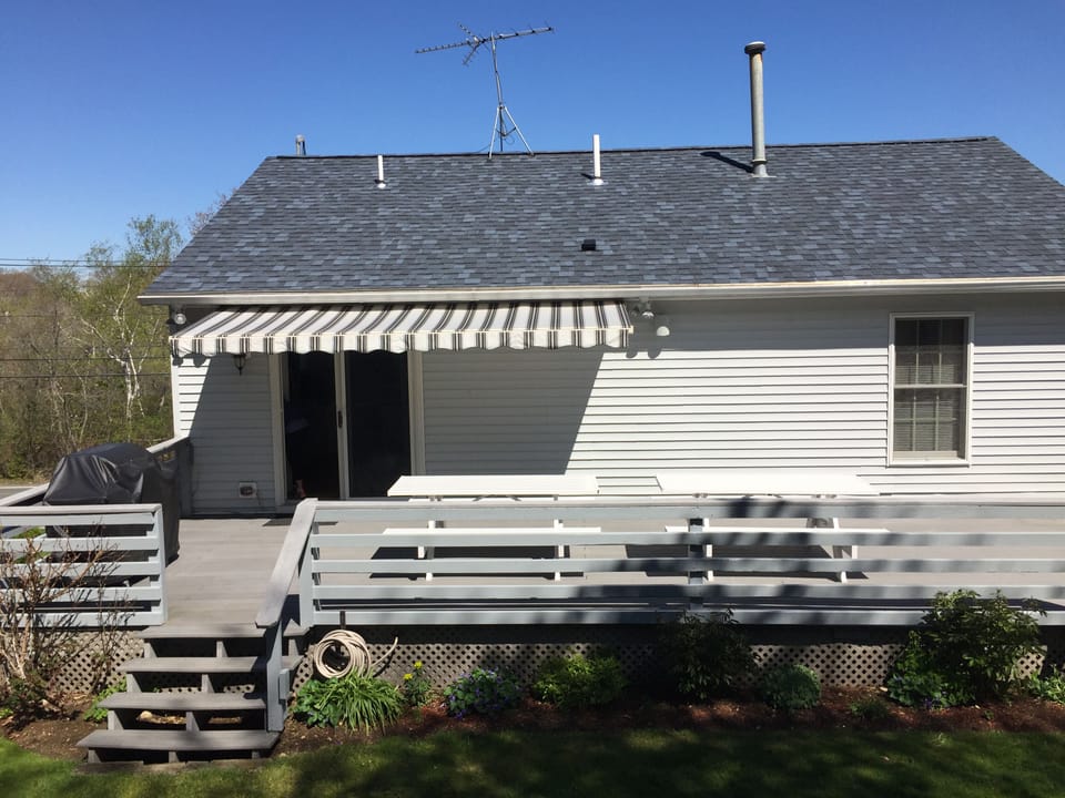 Gas grill, outdoor seating for up two 12 ppl, two lounge chairs, fenced in yard