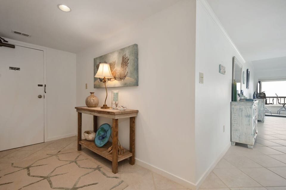 Entry way which opens to the kitchen and dining/living rooms.