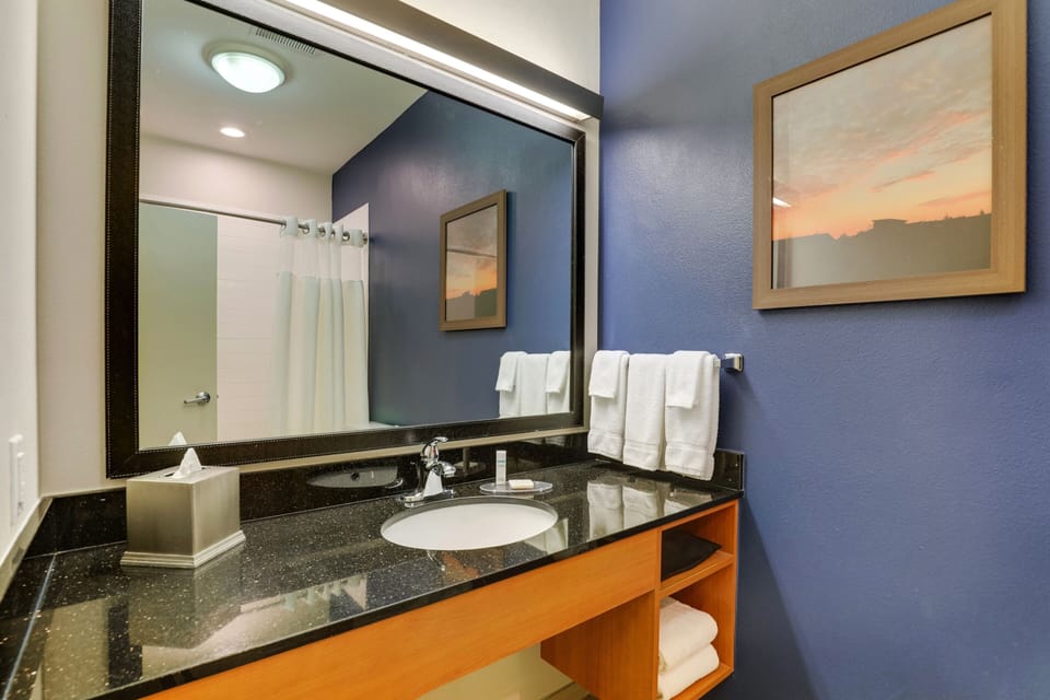 Designer toiletries, hair dryer, towels, soap