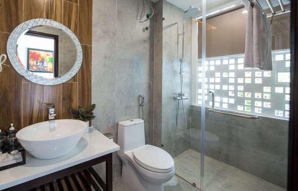 Shower, free toiletries, hair dryer, slippers