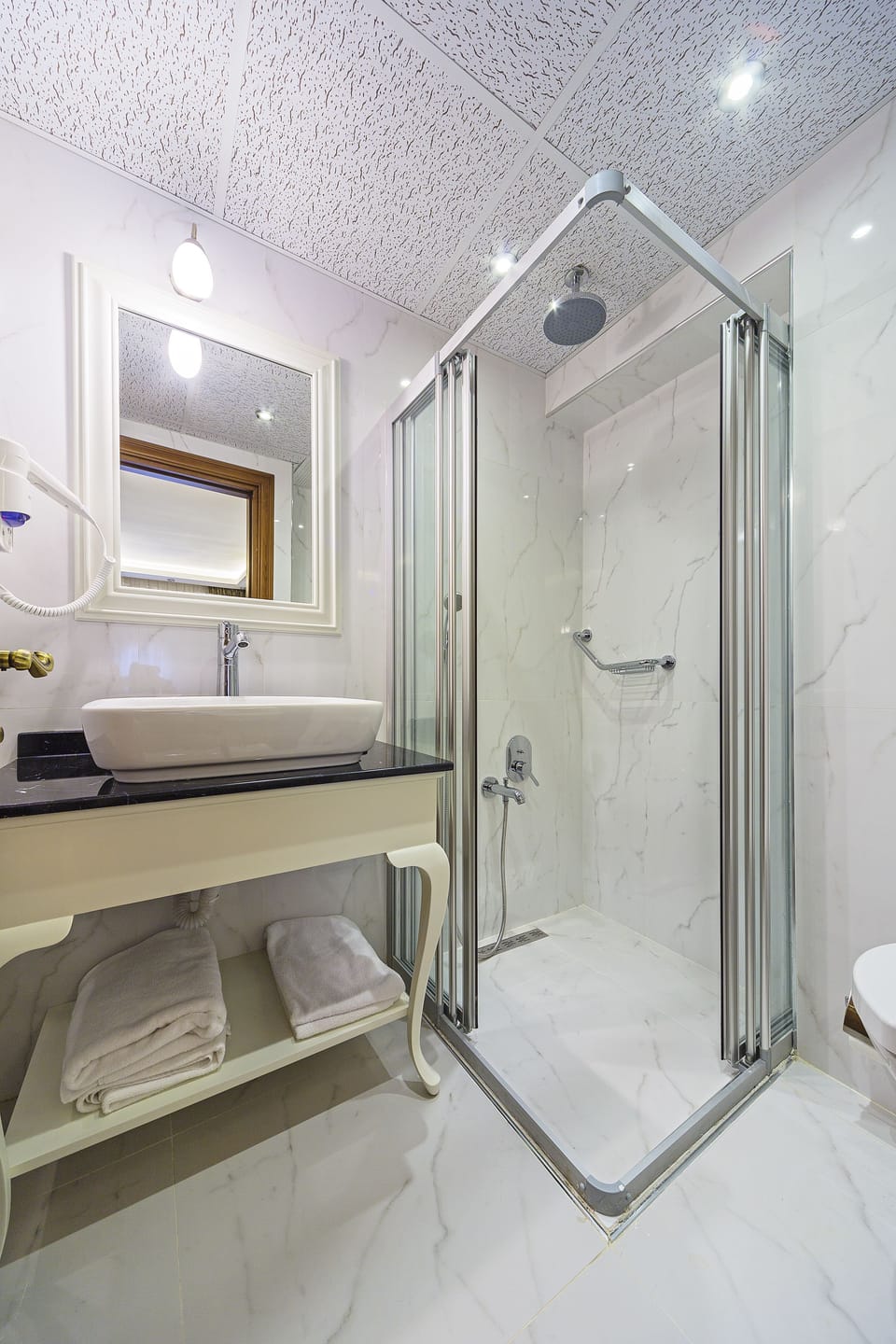 Shower, free toiletries, hair dryer, slippers