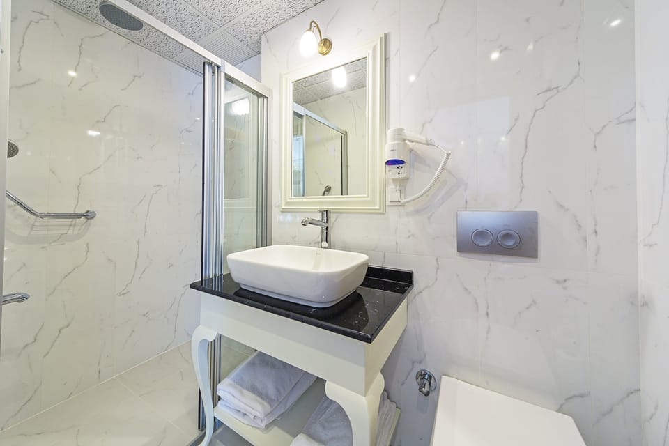 Shower, free toiletries, hair dryer, slippers