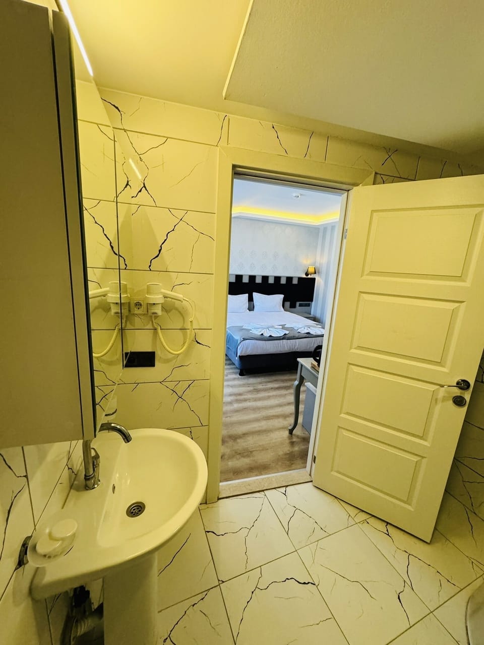 Shower, hair dryer, slippers, towels