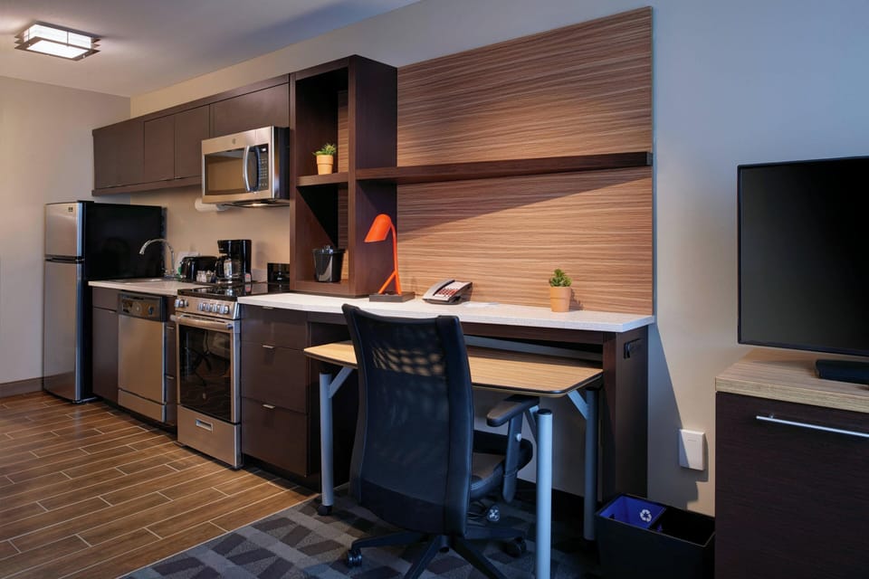 Laptop workspace, blackout drapes, iron/ironing board