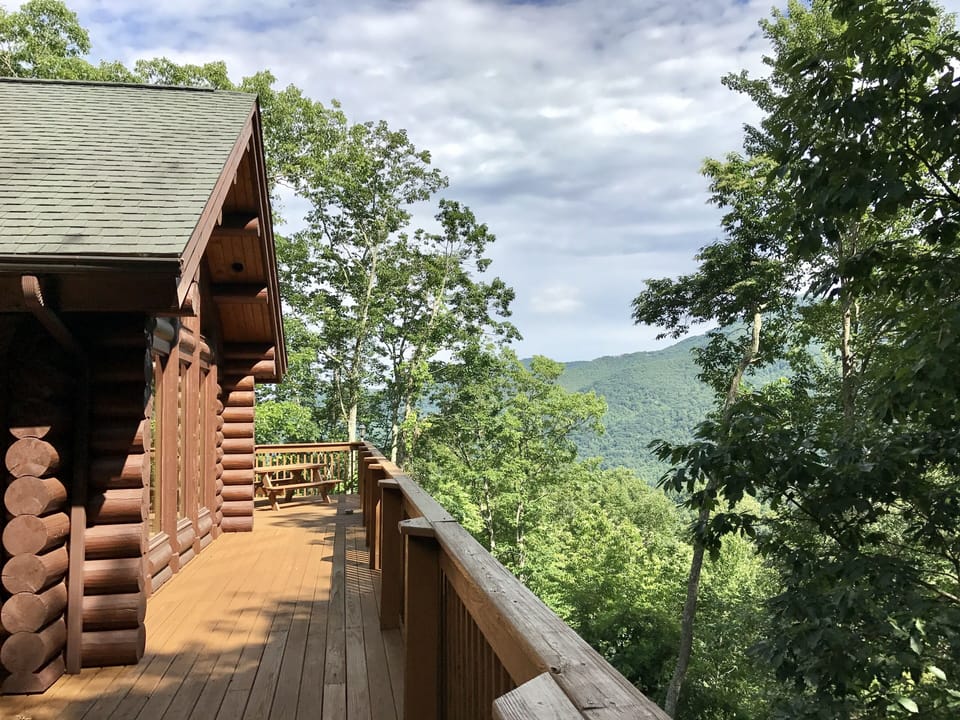 The deck is spacious L-shape. You have beautiful view from the deck Very PRIVATE
