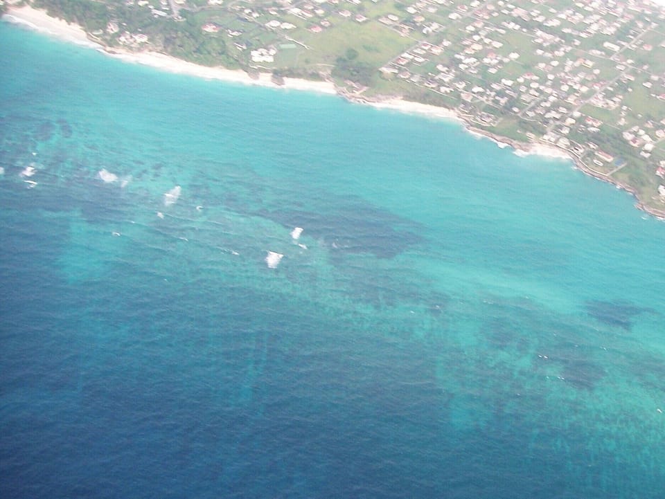 Aerial view of beaches surrounding villa (lower right beach below villa)