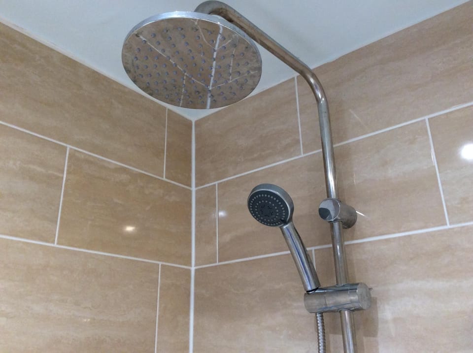 Down stairs cloak room with shower, sink and WC