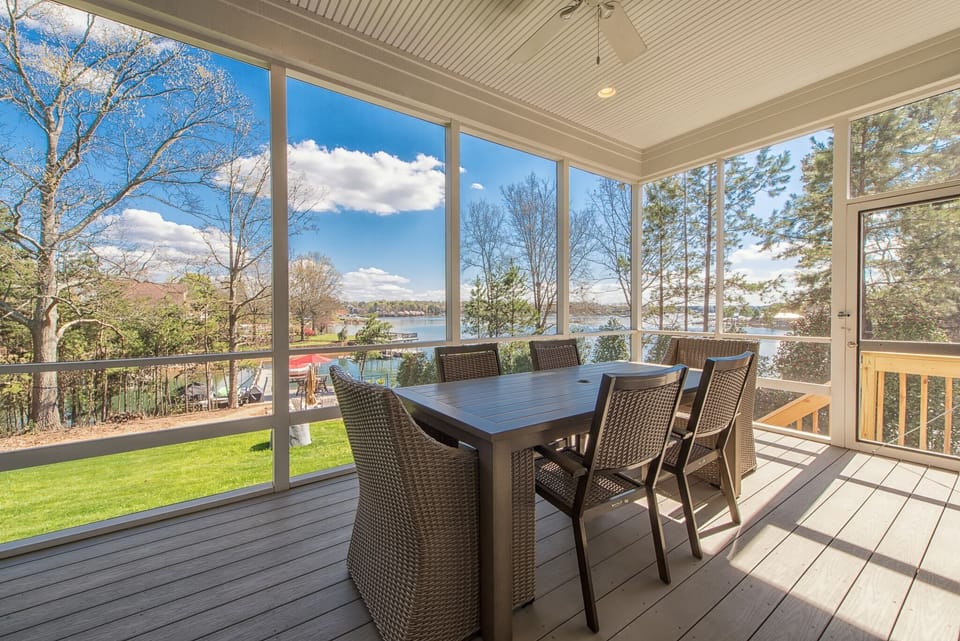Screened in porch off of the great room over looking the lake