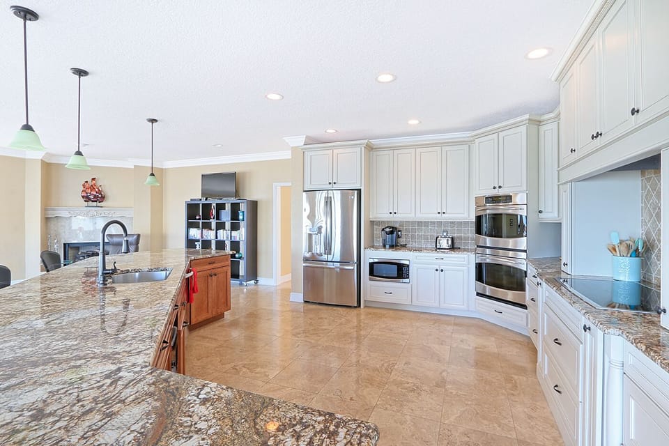 Double wall oven, microwave, electric cooktop.
