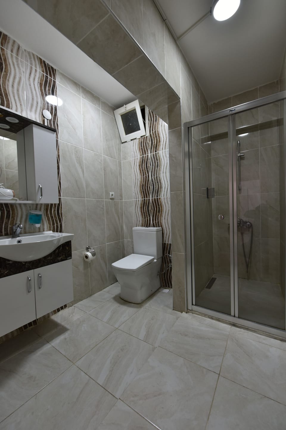 Shower, free toiletries, hair dryer, slippers