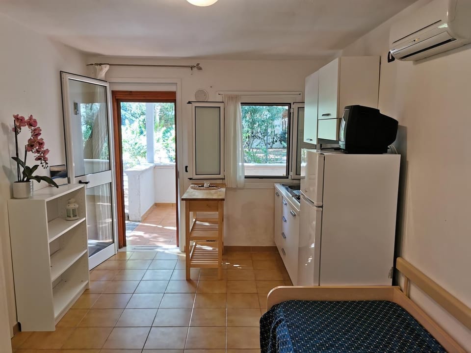Bungalow, 2 Bedrooms, Poolside (4 pax) | Living area | Flat-screen TV
