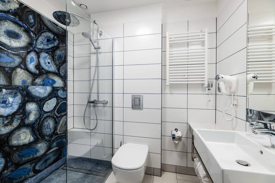 Shower, free toiletries, hair dryer, slippers