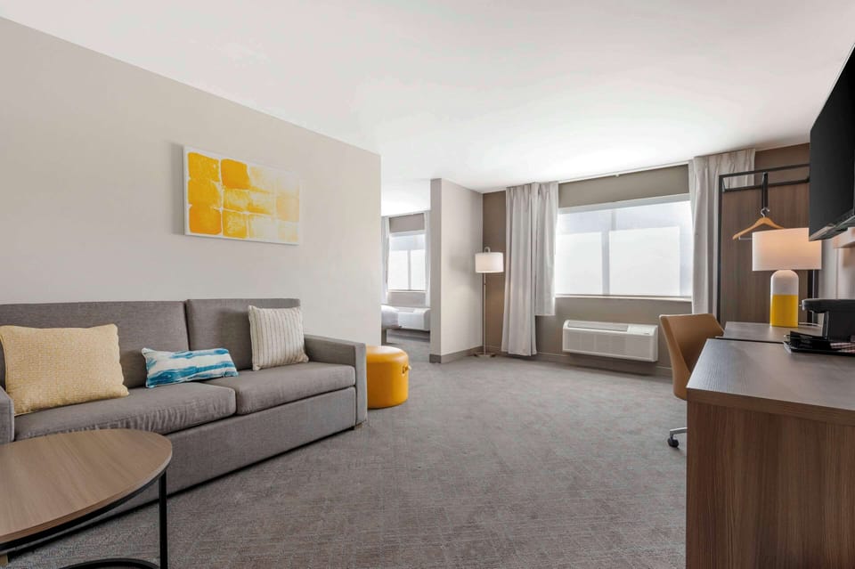 Desk, blackout drapes, iron/ironing board, rollaway beds