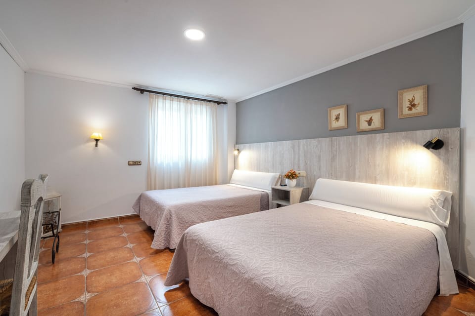 Superior Quadruple Room | Premium bedding, down comforters, desk, WiFi (free)