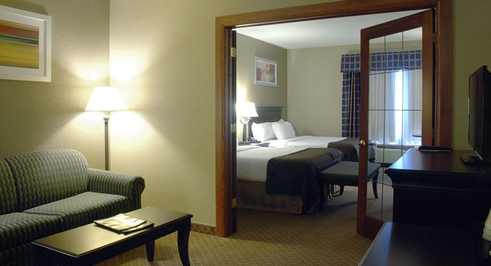 Family Suite, 1 Bedroom | Blackout drapes, iron/ironing board, free cribs/infant beds