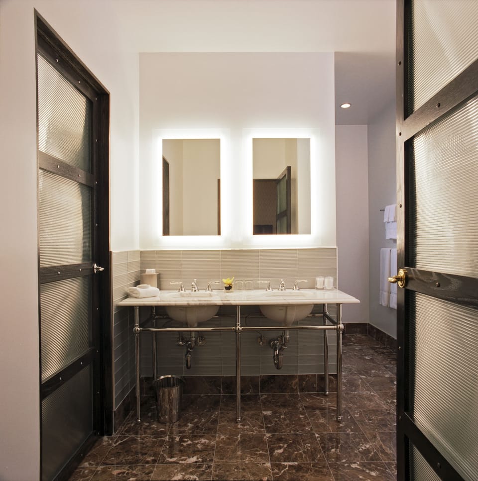 Combined shower/tub, designer toiletries, hair dryer, bathrobes
