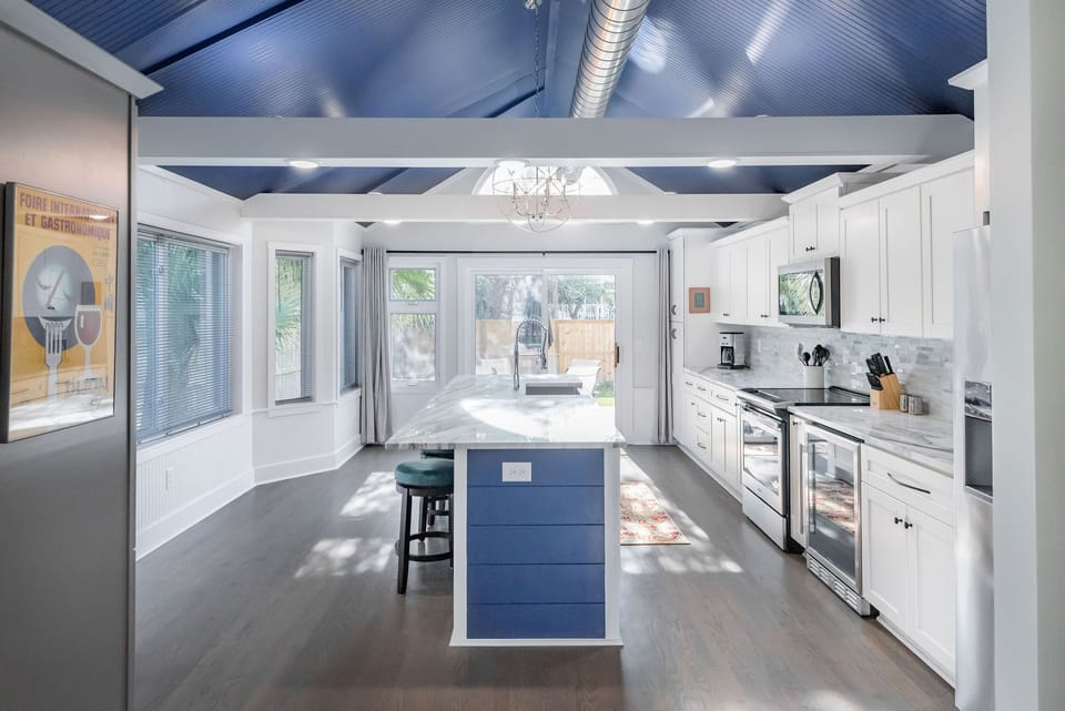 This amazing kitchen boasts custom cabinets and modern appliances.