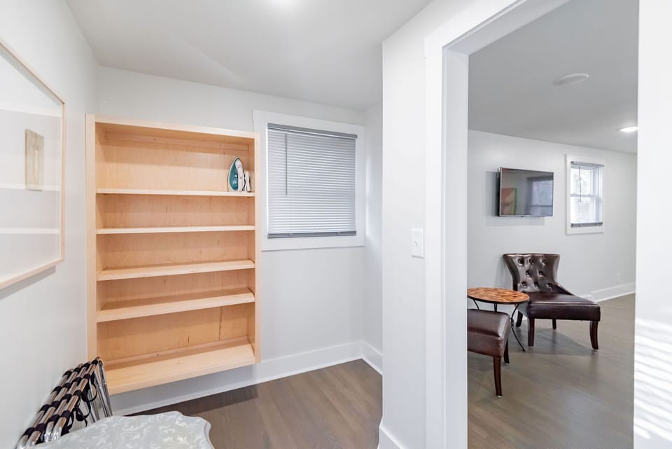 The large closet has plenty of space and custom built-ins.
