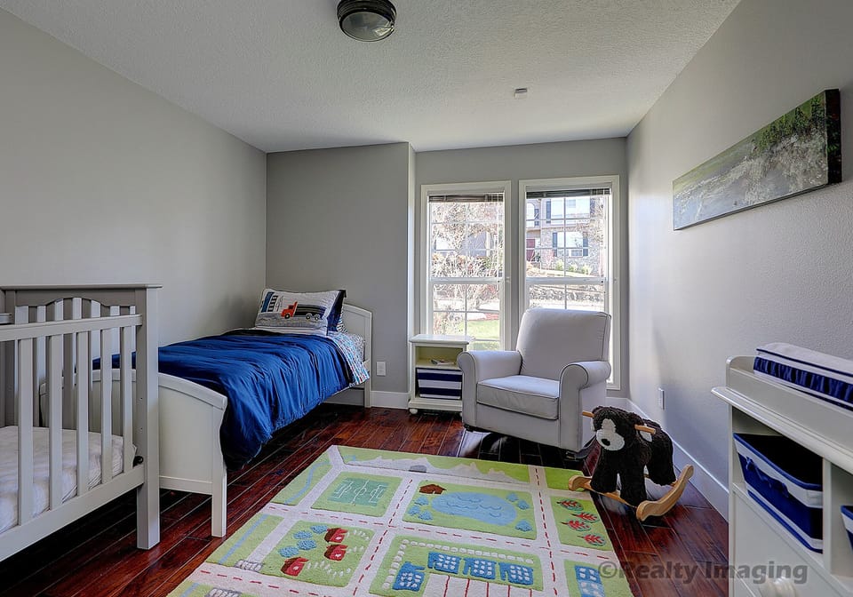 Bedroom #3 with a twin bed and a crib