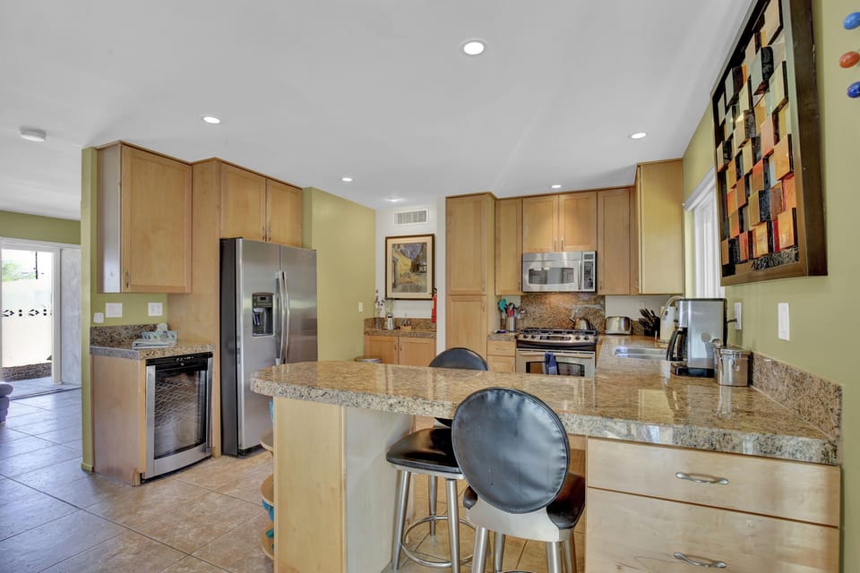 View of kitchen and eating area from dining room