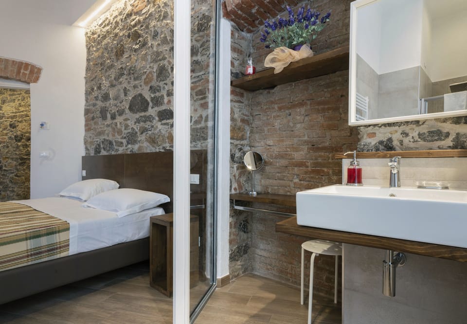 Superior Triple Room | Bathroom amenities | Shower, hydromassage showerhead, eco-friendly toiletries, hair dryer