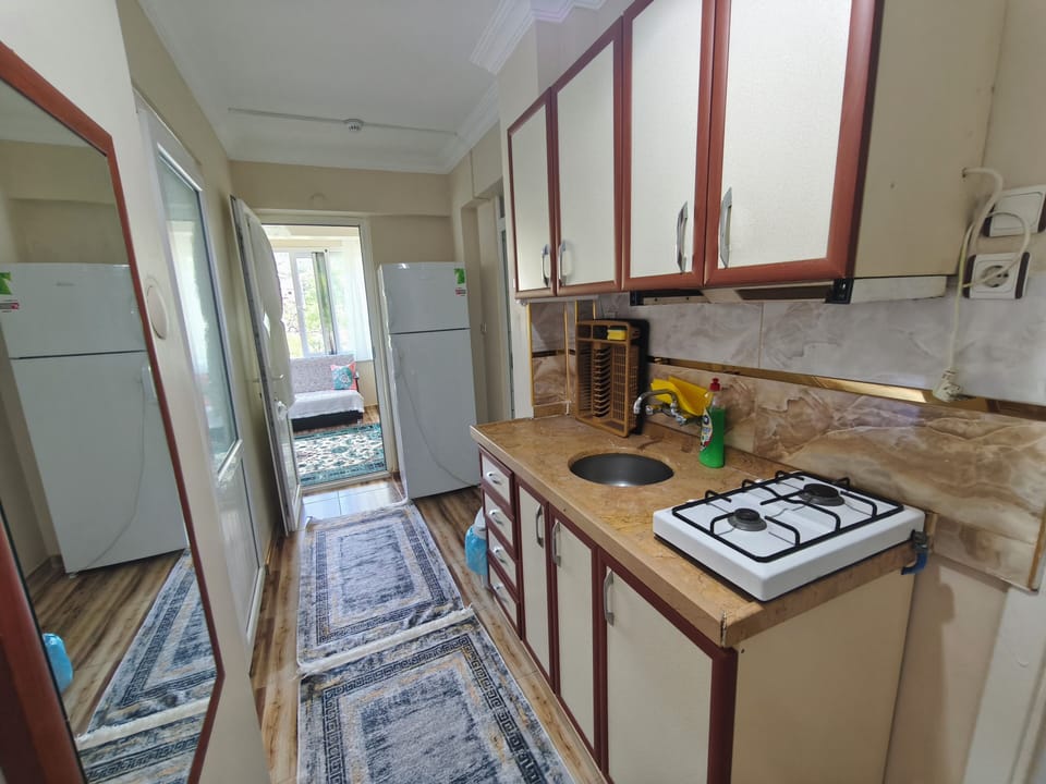 Junior Condo, Kitchen, Garden View | Private kitchen | Coffee/tea maker, full-size fridge, oven, stovetop