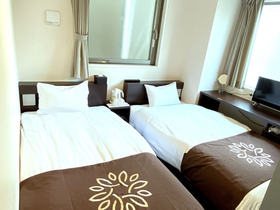 Business Twin Room, 2 Twin Beds, Non Smoking, City View | Down comforters, blackout drapes, soundproofing, iron/ironing board