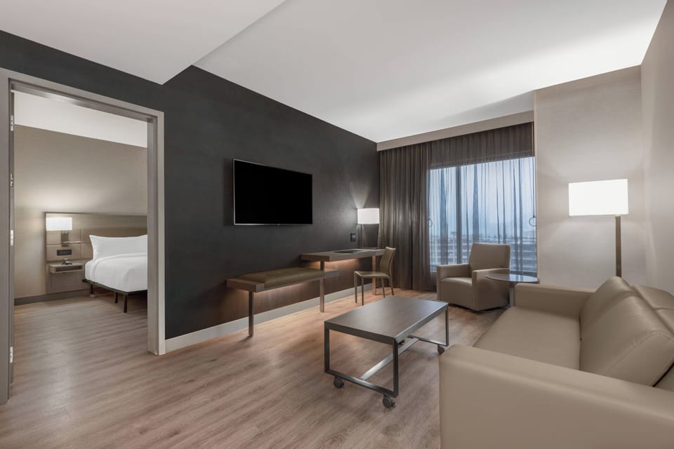 Suite, 1 Bedroom, Accessible Bathtub (High Floor) | Living room | 49-inch LCD TV with satellite channels, TV