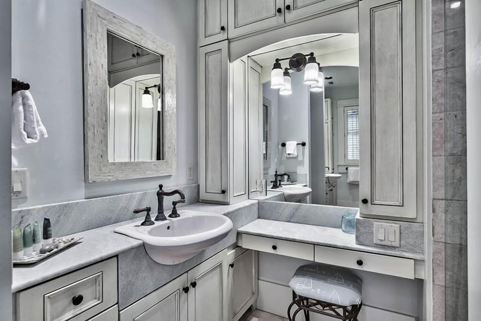 The master bath features double sinks and a vanity area