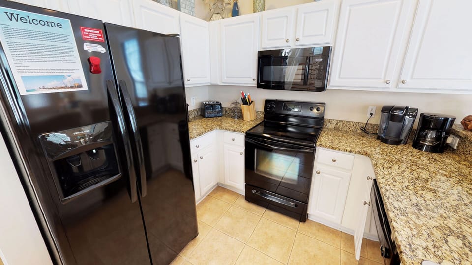 Bright and functional kitchen with ample counter space for easy vacation cooking and entertaining.