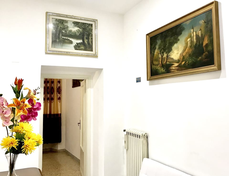 Family Apartment, 4 Bedrooms, Kitchen, City View | Living area | Flat-screen TV, heated floors