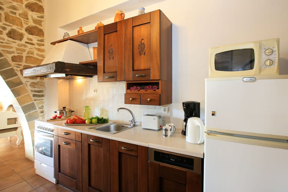 Villa | Private kitchen | Fridge, oven, stovetop, electric kettle