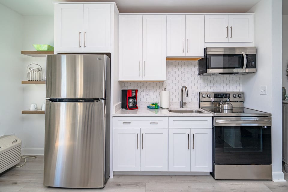 Designer backsplash, all new appliances too!  Fully stocked kitchen