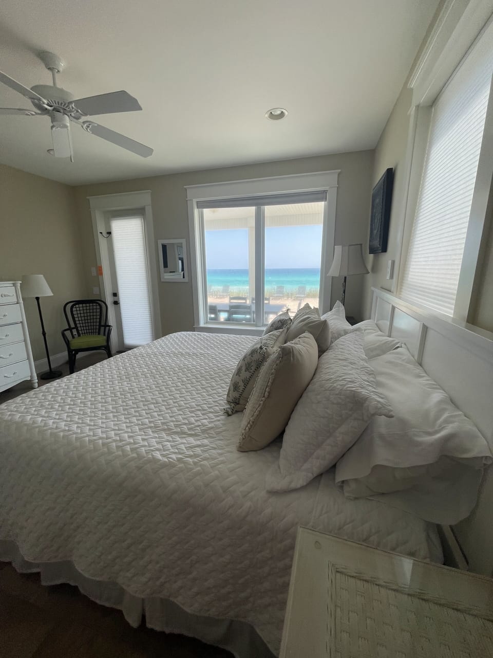 King bedroom with pool and ocean views and private access to porch by the pool.
