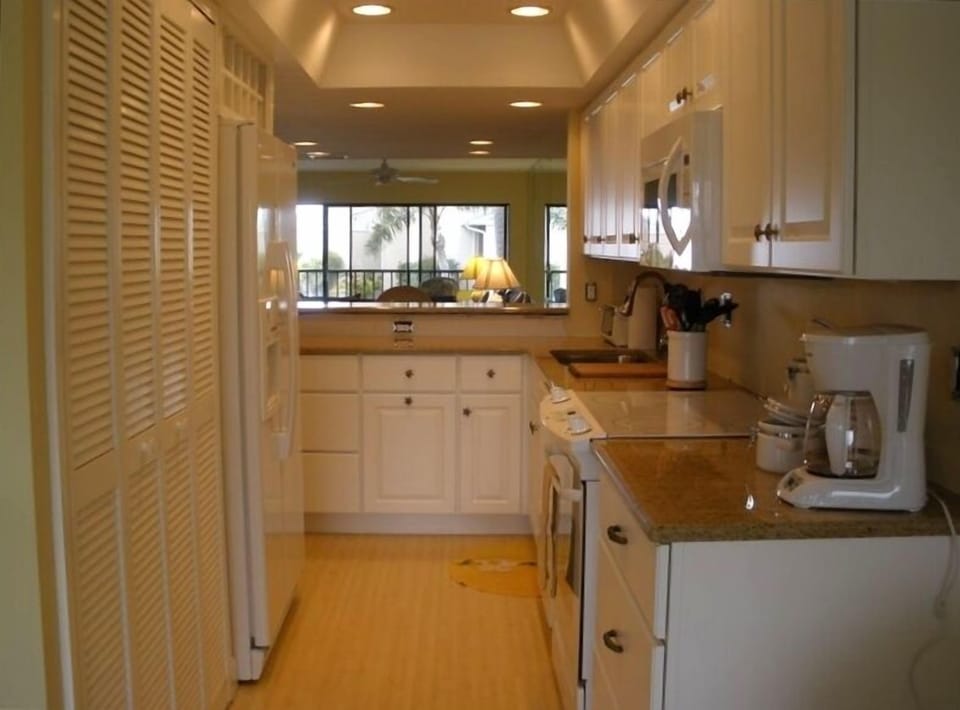 Kitchen from Den Looking Towards Living and Dining Areas