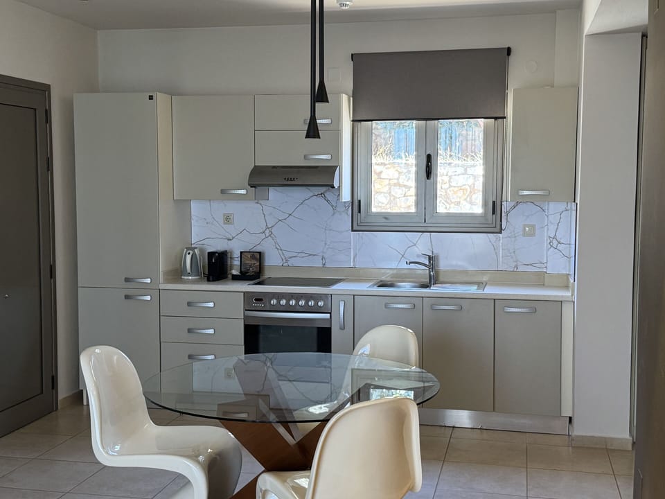 Suite with Pool View | Private kitchenette | Fridge, oven, stovetop, espresso maker
