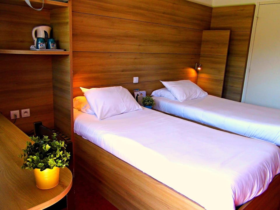 Premium bedding, desk, laptop workspace, iron/ironing board
