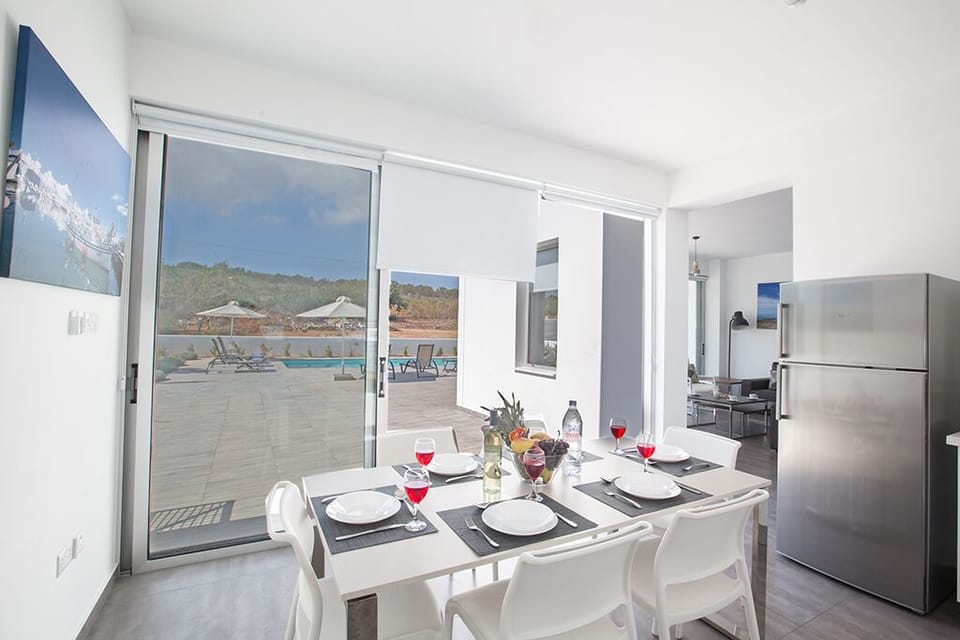 Dining area with large patio doors leading to the garden