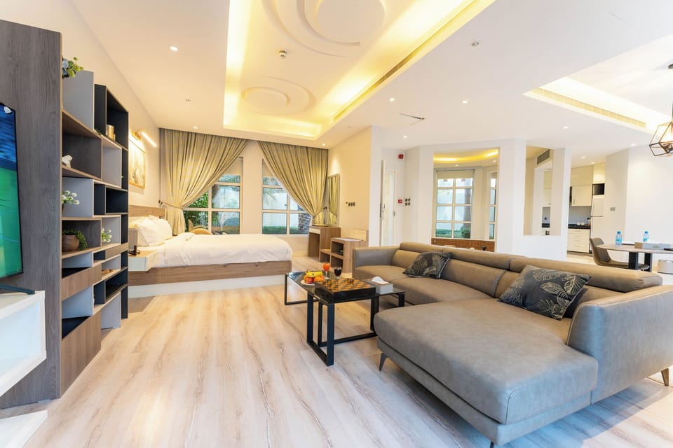 Honeymoon Villa (Private Jacuzzi) | Living area | 50-inch Smart TV with satellite channels, toys