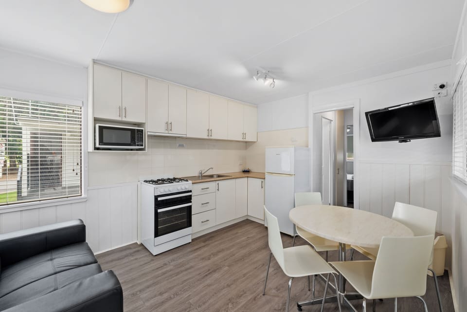One Bedroom Cabin | Private kitchen | Full-size fridge, microwave, stovetop, toaster